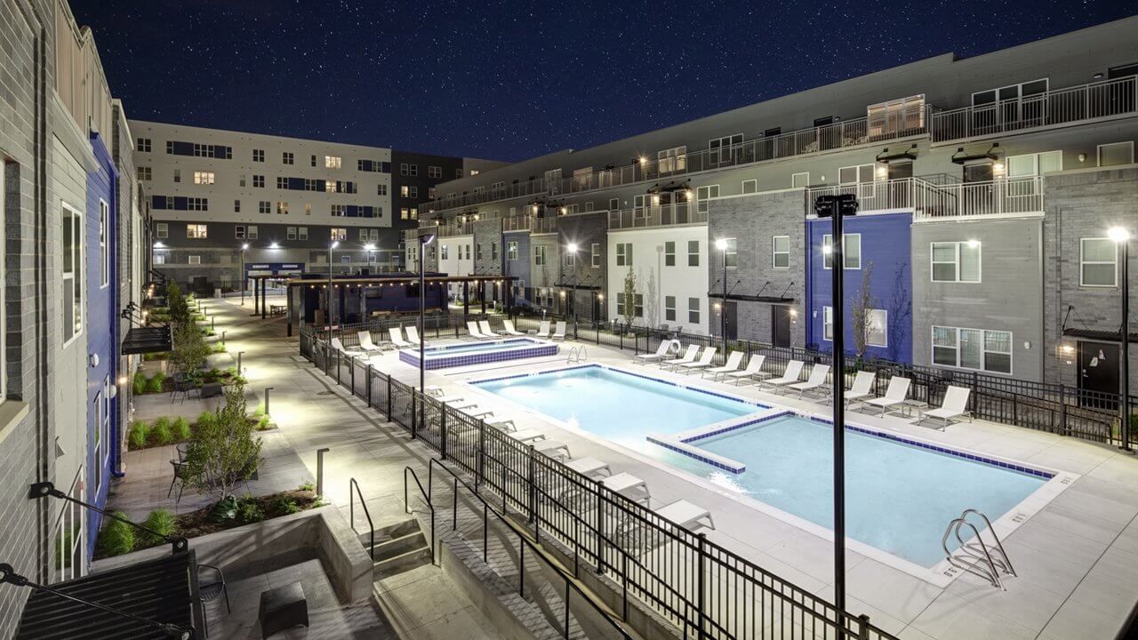 pool in inner courtyard lit up at night