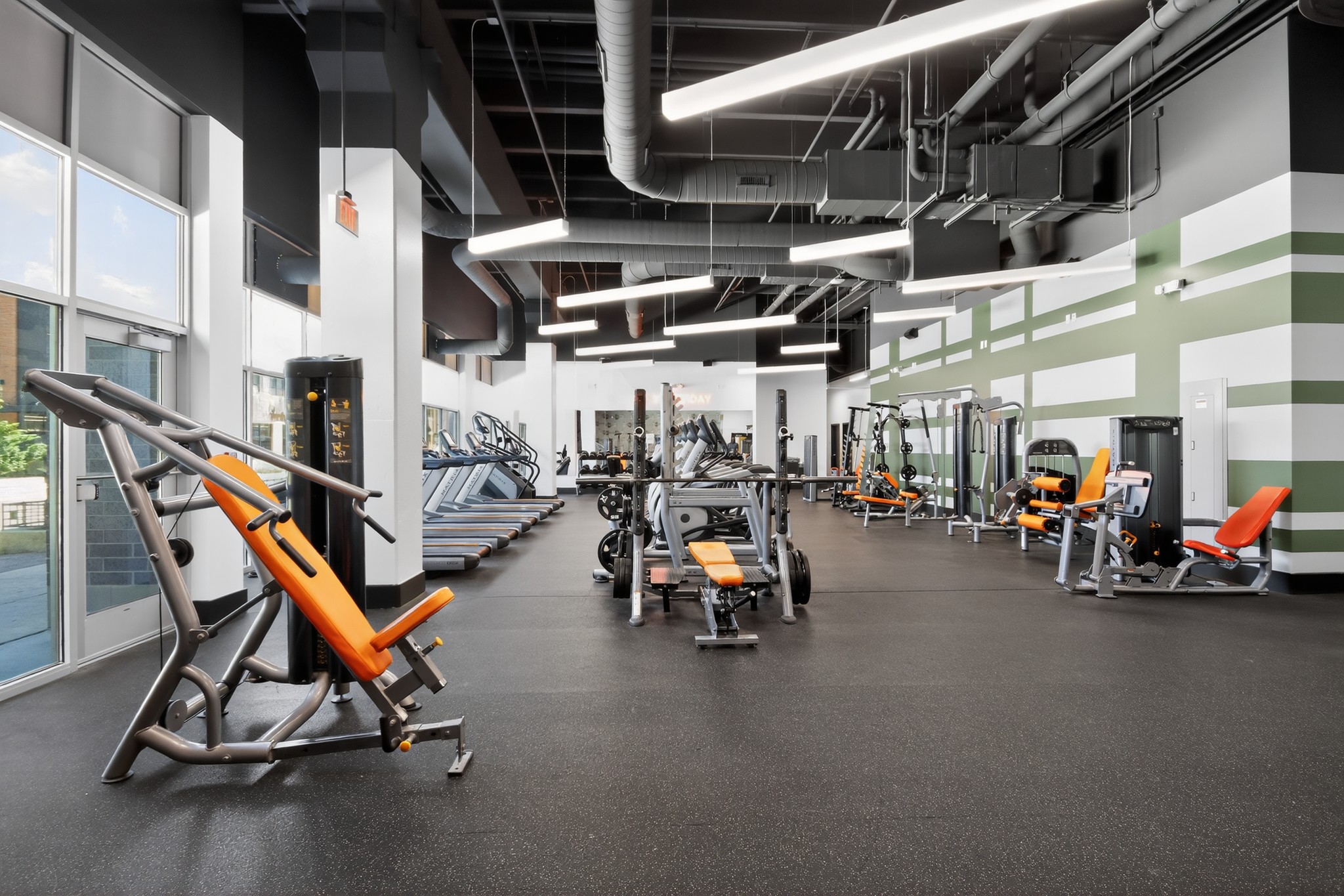 Fitness center with weight machines and cardio equipment